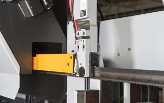 H-22A Idler Side Guide Arm Is Connected To Moveable Vise For Proper Spacing